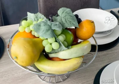 Bowl of fresh fruit including mango and banana - West Point Beach Resort