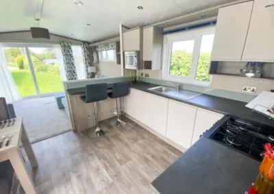 Caravan fitted kitchen with dark worktops - West Point Beach Resort
